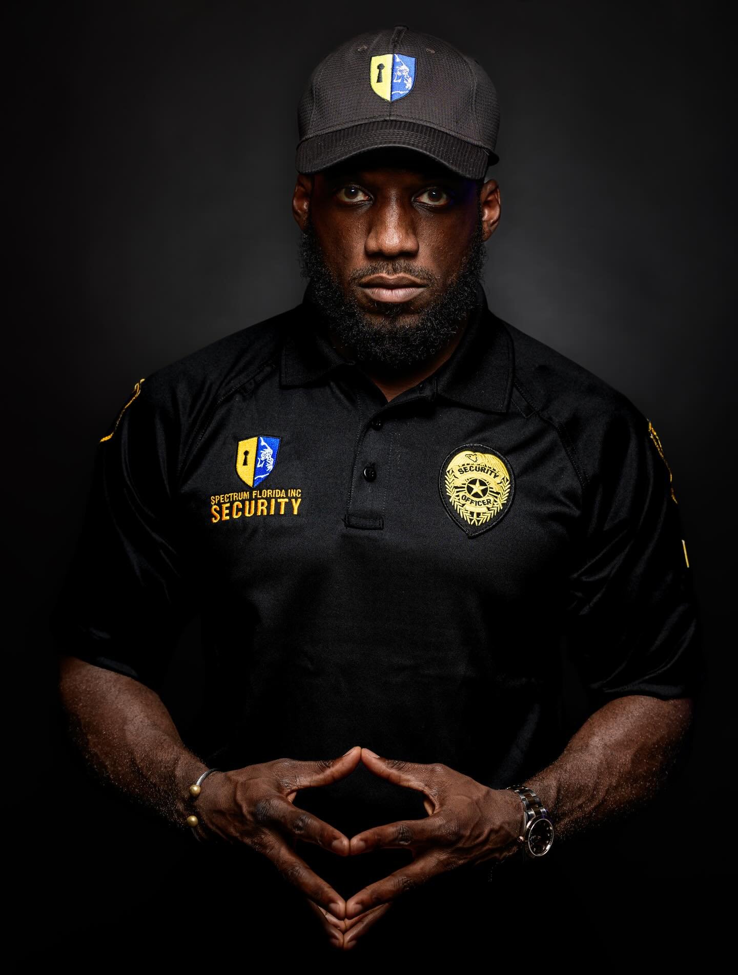 Studio portrait of a uniformed Spectrum Florida Security officer